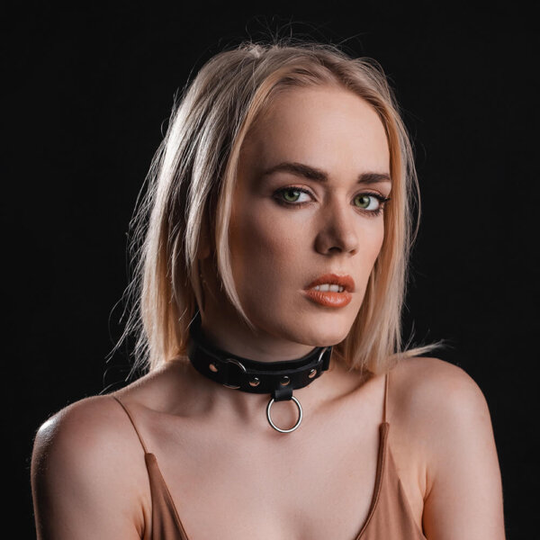 Young lady with black leather choker